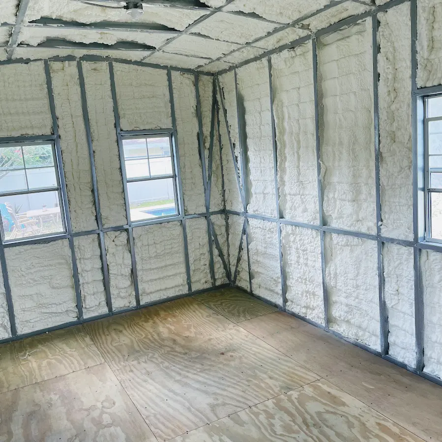 Closed-cell spray foam insulation applied to wall cavities in a residential project in Miramar